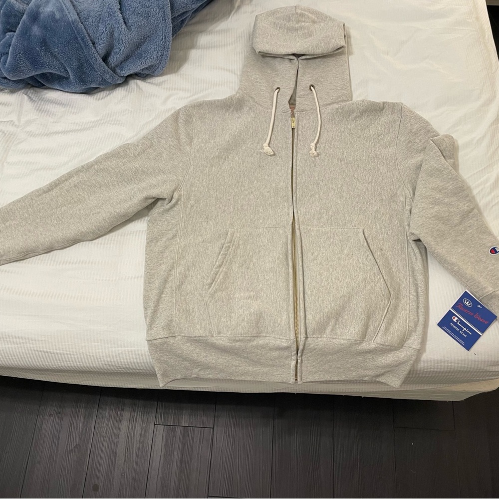 Brand new (with tag) gray Champion zip-up jacket!